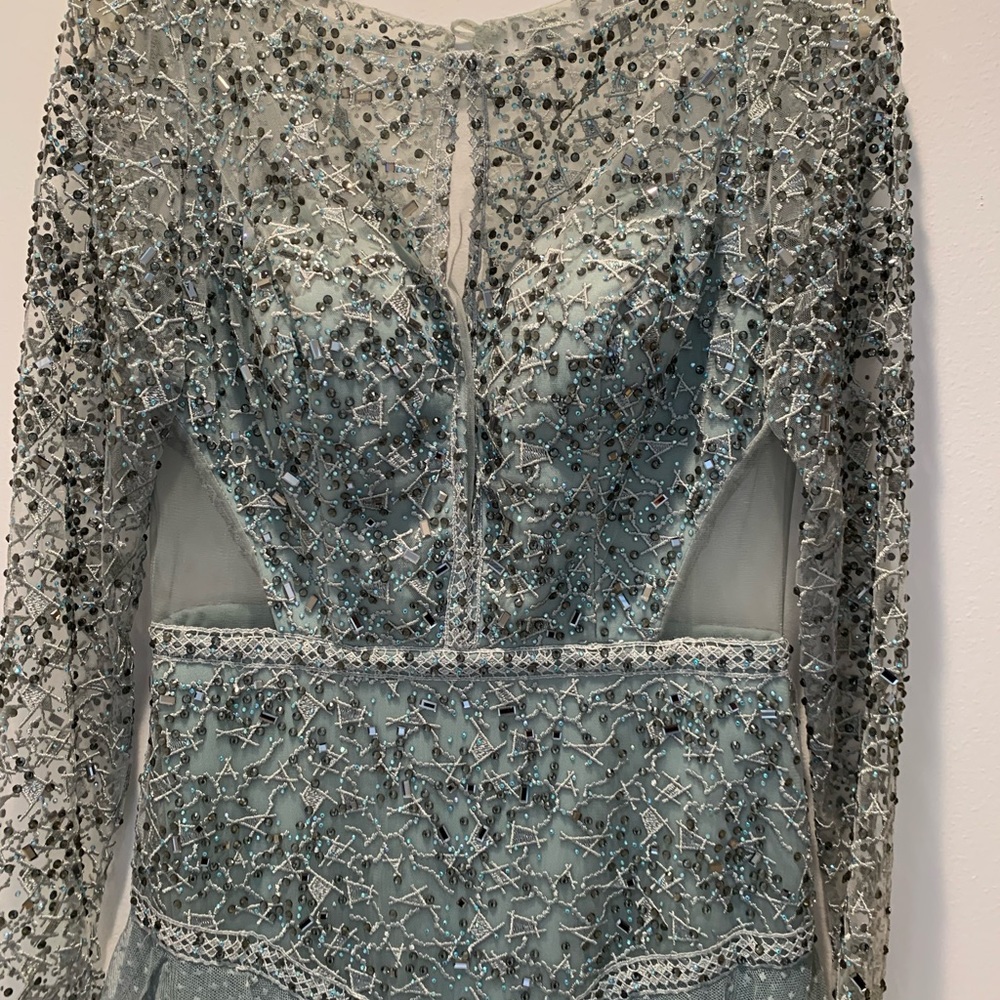 Prom/evening dress in seafoam green. Sheer cutout, sheer back and sleeves.